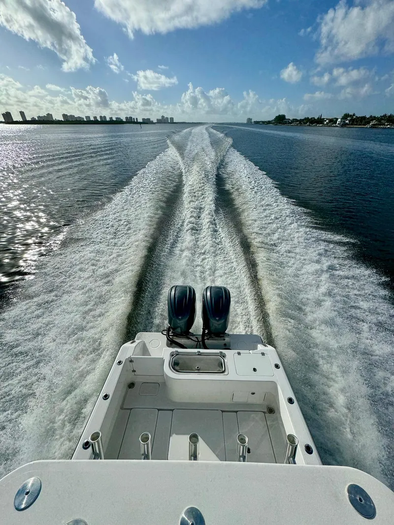 Slide: The Image of 2020 Invincible 33 Open Fisherman cruising on open water, leaving a wake trail. - 23