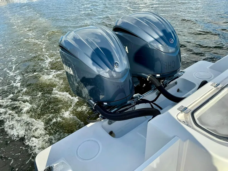 Slide: The Image of 2020 Invincible 33 Open Fisherman with dual Yamaha outboard engines on water. - 26