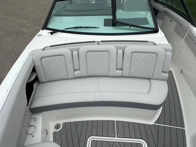 Slide: The Image of 2025 Sea Ray SLX 400 OB boat with luxurious seating and sleek design. - 9