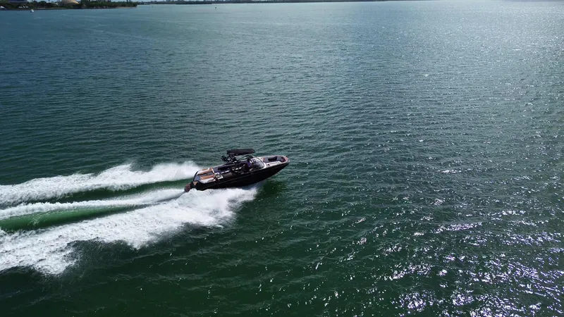 Slide: The Image of 2018 Nautique Super Air Nautique G25 speeding on open water. - 21
