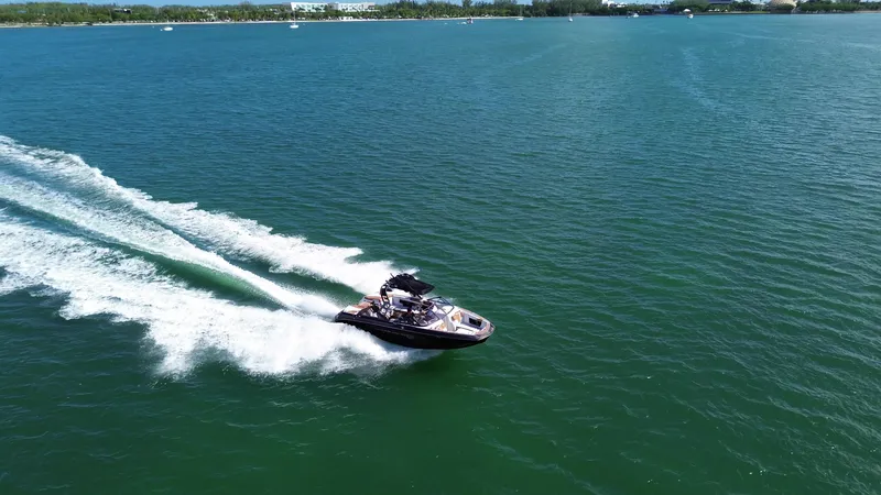 Slide: The Image of 2018 Nautique Super Air Nautique G25 speeding on open water. - 23