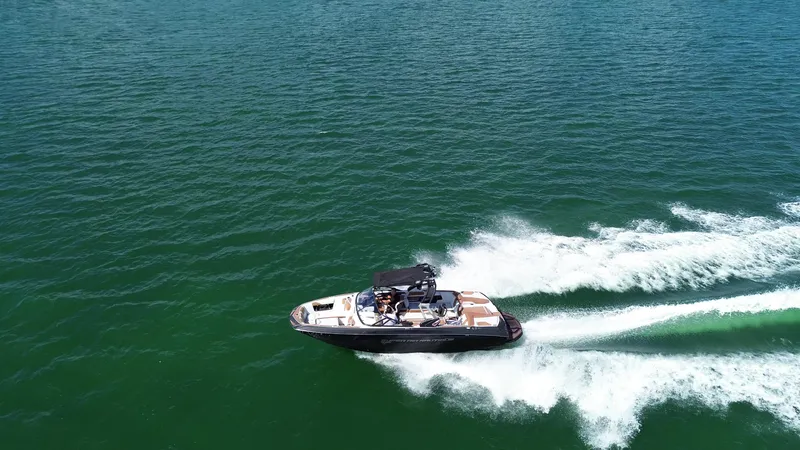 Slide: The Image of 2018 Nautique Super Air Nautique G25 speeding on open water. - 26