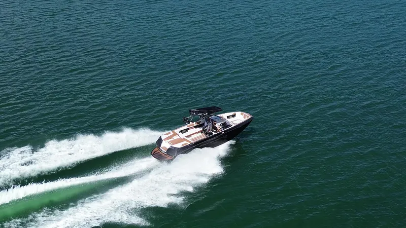 Slide: The Image of 2018 Nautique Super Air Nautique G25 speeding on open water. - 34