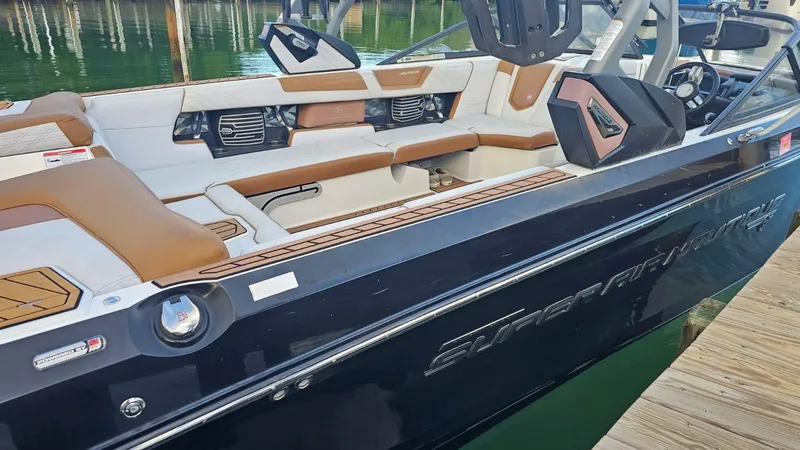 Slide: The Image of 2018 Nautique Super Air Nautique G25 boat with luxurious seating and sleek design. - 9