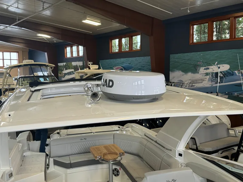 Slide: The Image of 2025 Sea Ray SLX 350 luxury boat interior with radar, showcased indoors. - 22