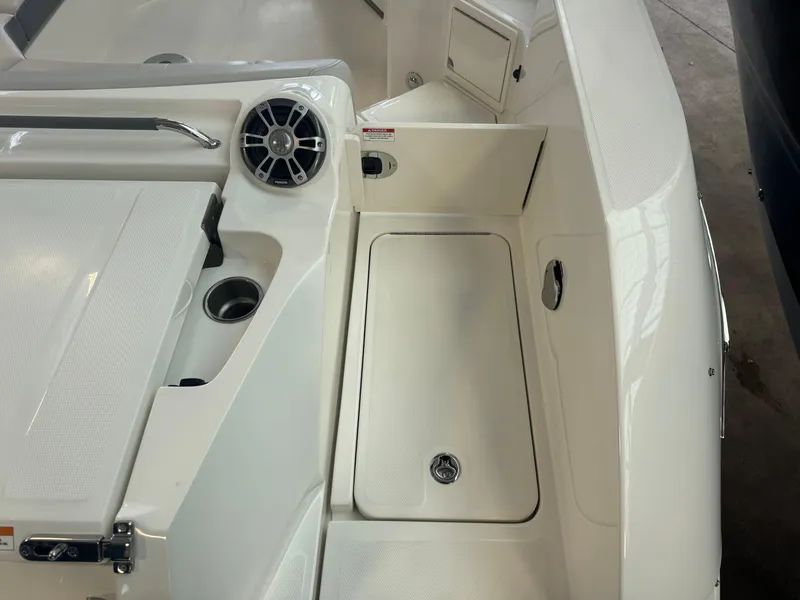 Slide: The Image of 2025 Sea Ray SLX 350 boat interior with speaker and storage compartment. - 6