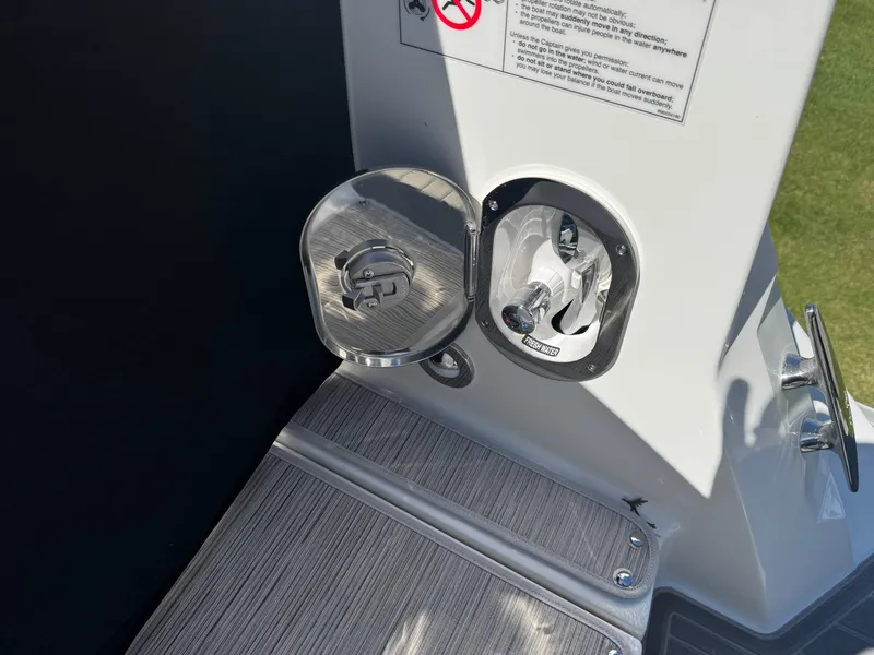 Slide: The Image of 2025 Sea Ray Sundancer 320 Coupe fuel cap and deck detail. - 12