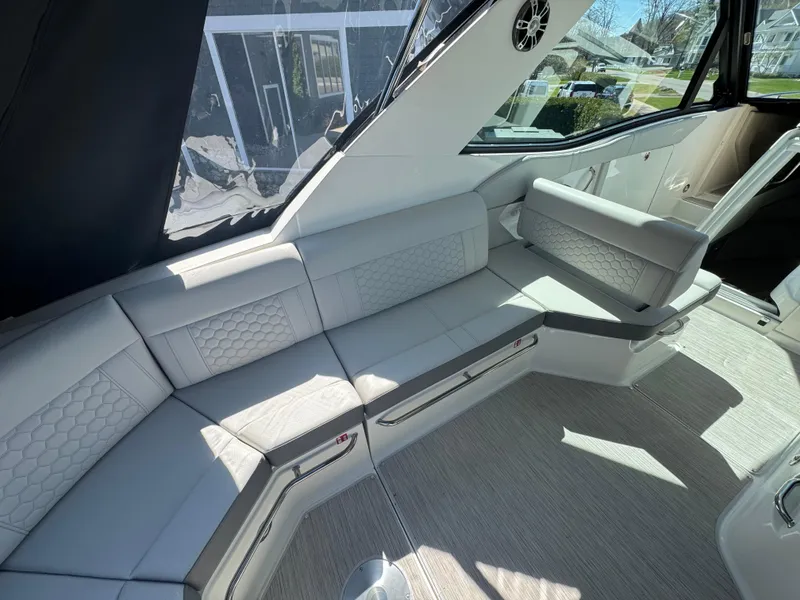 Slide: The Image of Luxurious interior of 2025 Sea Ray Sundancer 320 Coupe with elegant seating. - 17
