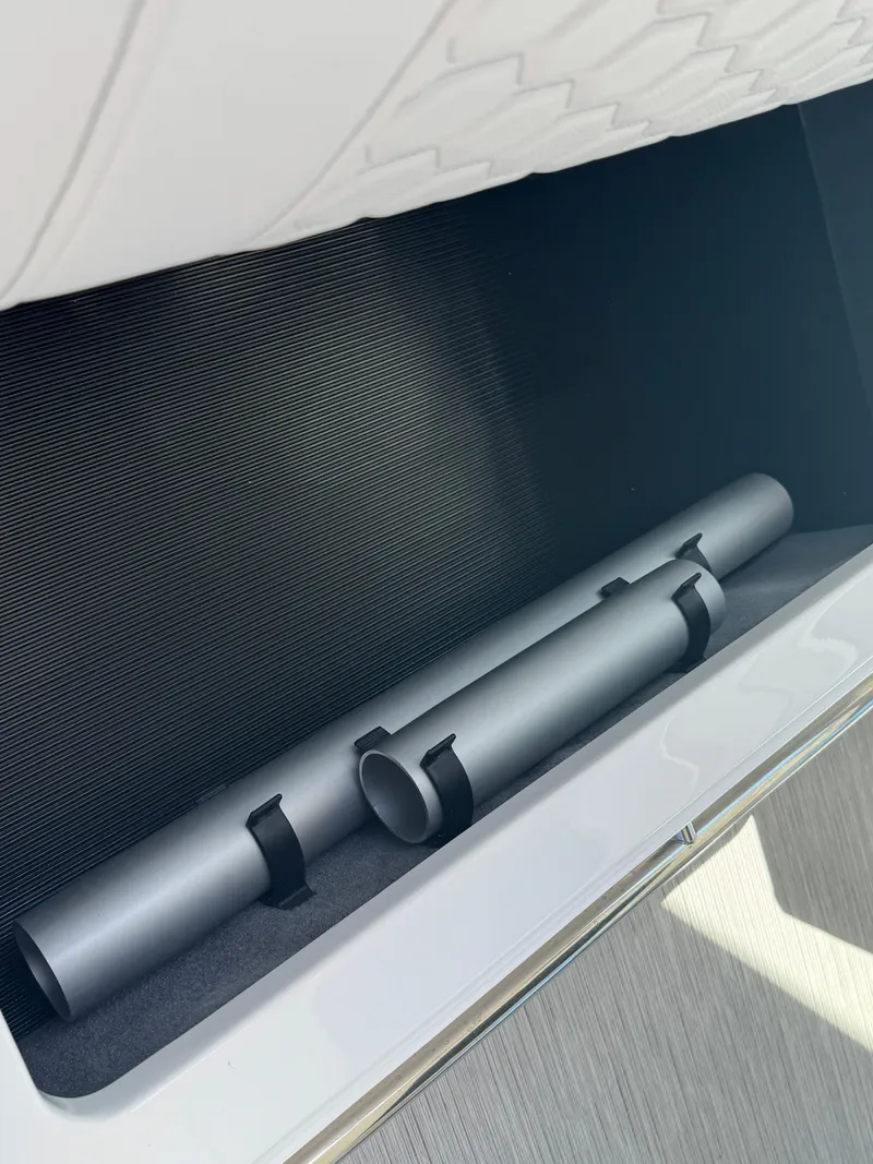 Slide: The Image of Storage compartment in 2025 Sea Ray Sundancer 320 Coupe, featuring sleek design and secure fittings. - 18