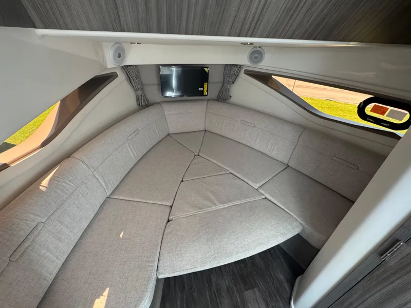 Slide: The Image of Interior of 2025 Sea Ray Sundancer 320 Coupe with modern seating and sleek design. - 26