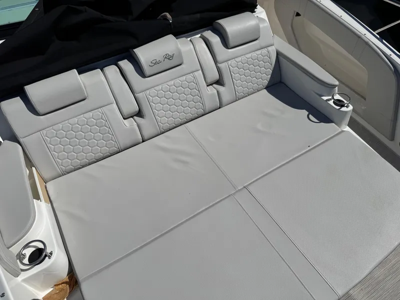 Slide: The Image of 2025 Sea Ray Sundancer 320 Coupe, luxurious gray seating with cup holders. - 4