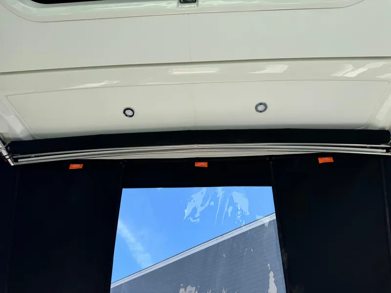 Slide: The Image of 2025 Sea Ray Sundancer 320 Coupe interior ceiling with sleek design and modern lighting. - 8