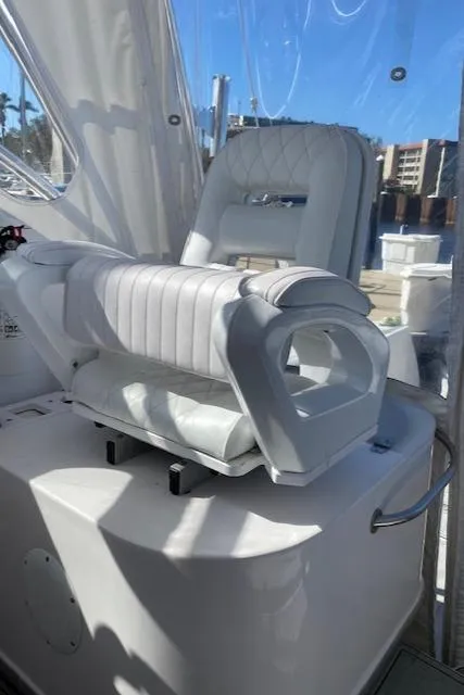 Slide: The Image of 2005 Pro-Line Express boat interior with white cushioned seating. - 11
