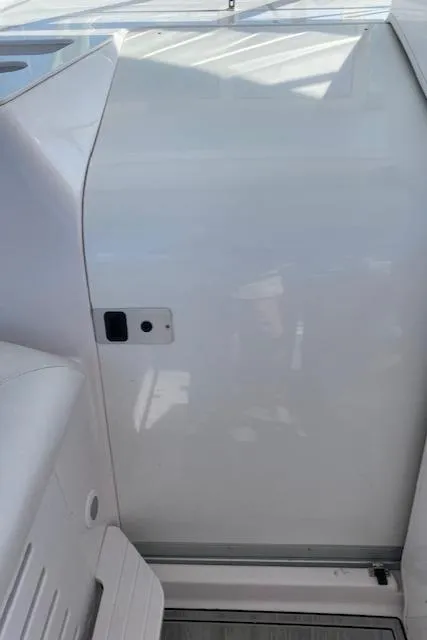 Slide: The Image of 2005 Pro-Line Express boat interior with sleek white design. - 14