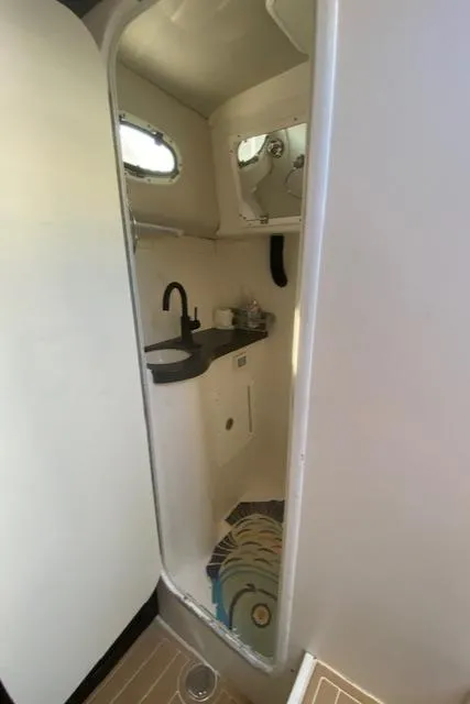 Slide: The Image of 2005 Pro-Line Express boat interior bathroom with sink and mirror. - 20