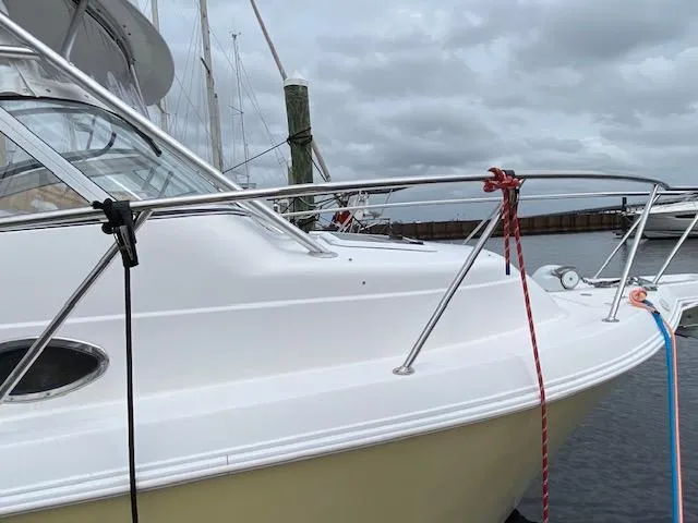 Slide: The Image of 2005 Pro-Line Express boat docked with cloudy sky background. - 3