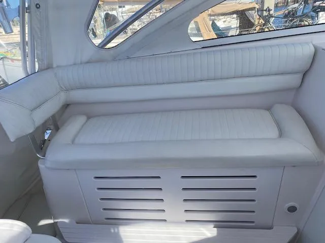 Slide: The Image of 2005 Pro-Line Express boat interior with white cushioned seating. - 7