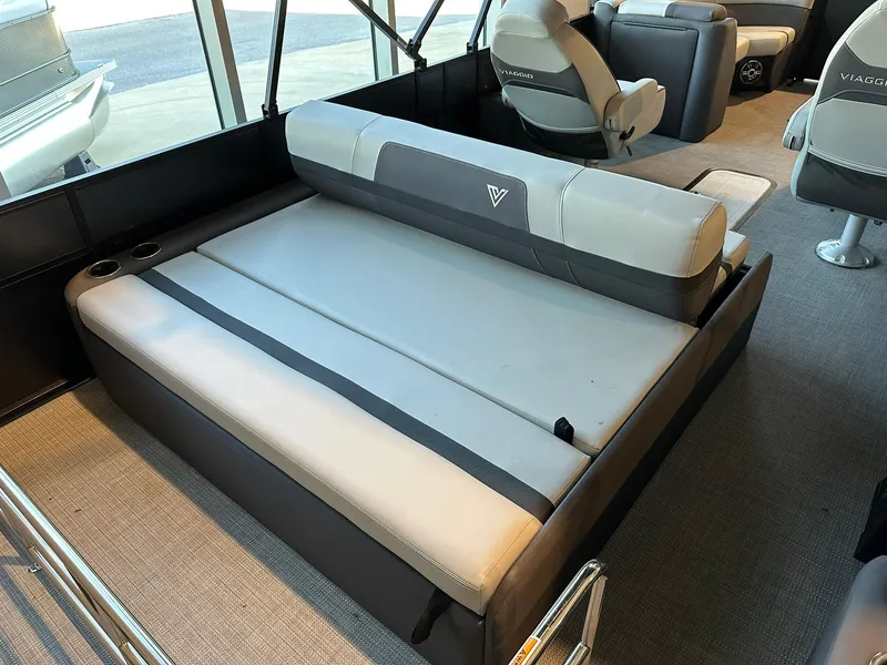 Slide: The Image of 2025 Viaggio Lago X-S boat interior with gray seating and modern design. - 10