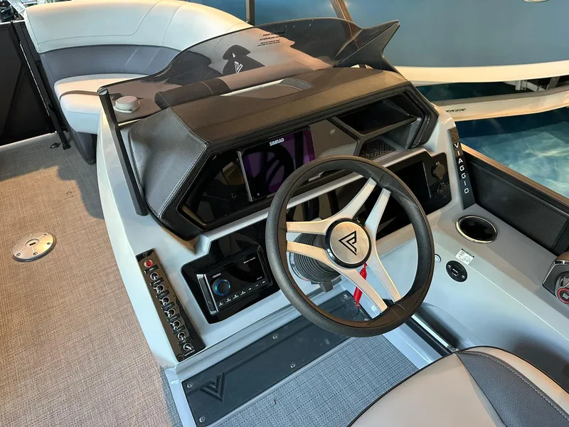 Slide: The Image of Viaggio Lago X-S 2025 boat interior with modern steering wheel and dashboard controls. - 4