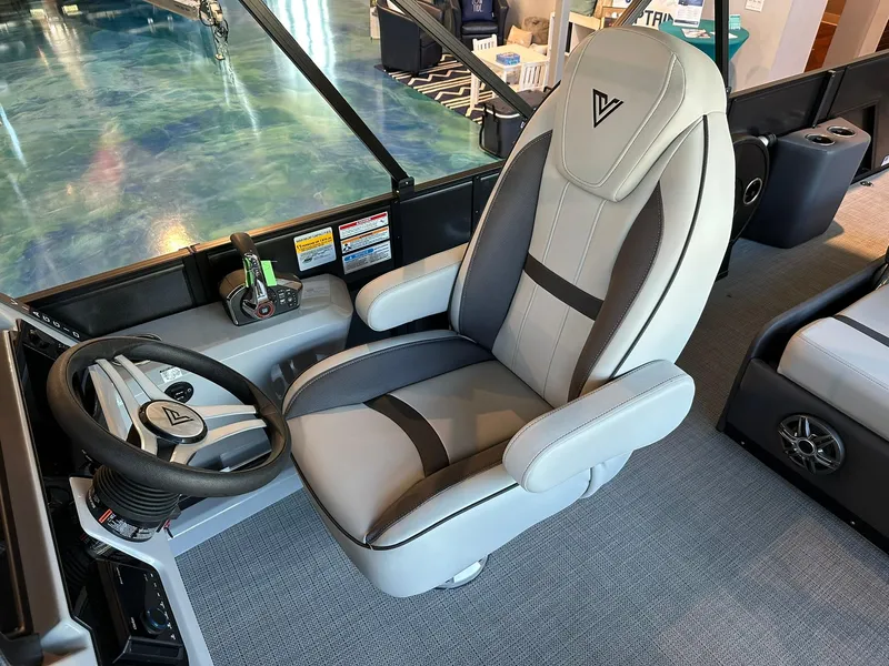 Slide: The Image of Captain's seat in 2025 Viaggio Lago X-S boat, featuring sleek design and modern controls. - 5