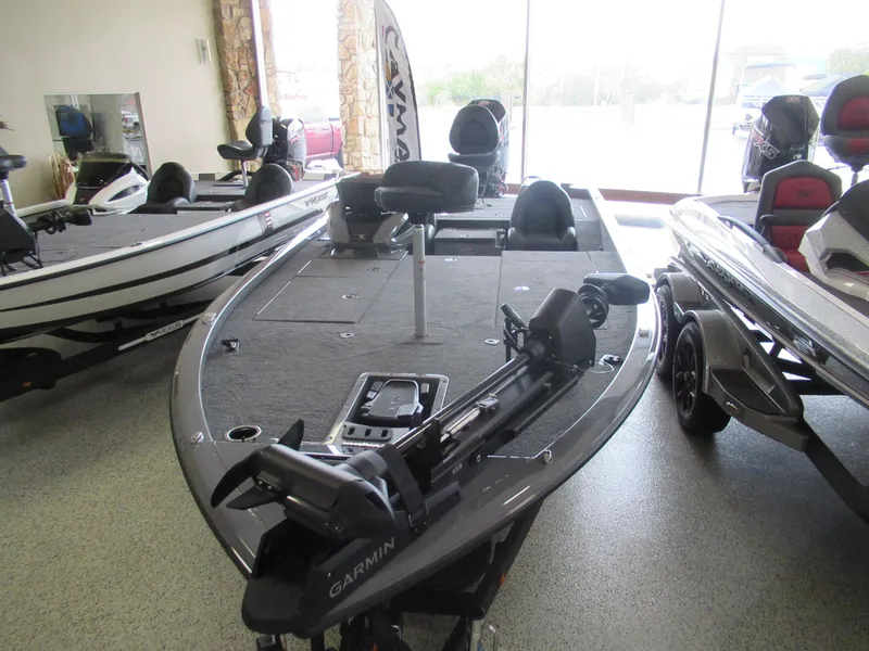 Slide: The Image of 2025 Vexus AVX 2080 fishing boat in showroom, featuring Garmin equipment. - 3