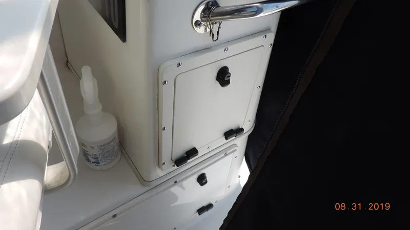 Slide: The Image of Boston Whaler 295 Conquest WA 2002 boat interior storage compartment. - 16