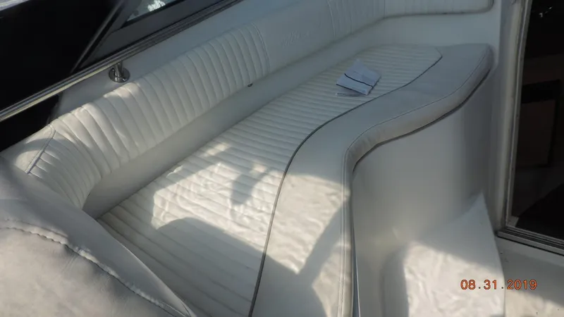 Slide: The Image of White leather seating on a 2002 Boston Whaler 295 Conquest WA boat. - 17