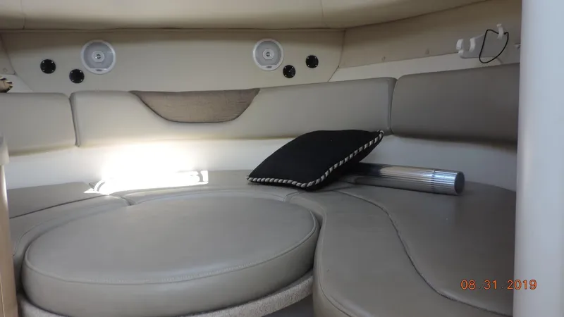 Slide: The Image of Interior cabin of 2002 Boston Whaler 295 Conquest WA with cushioned seating. - 19