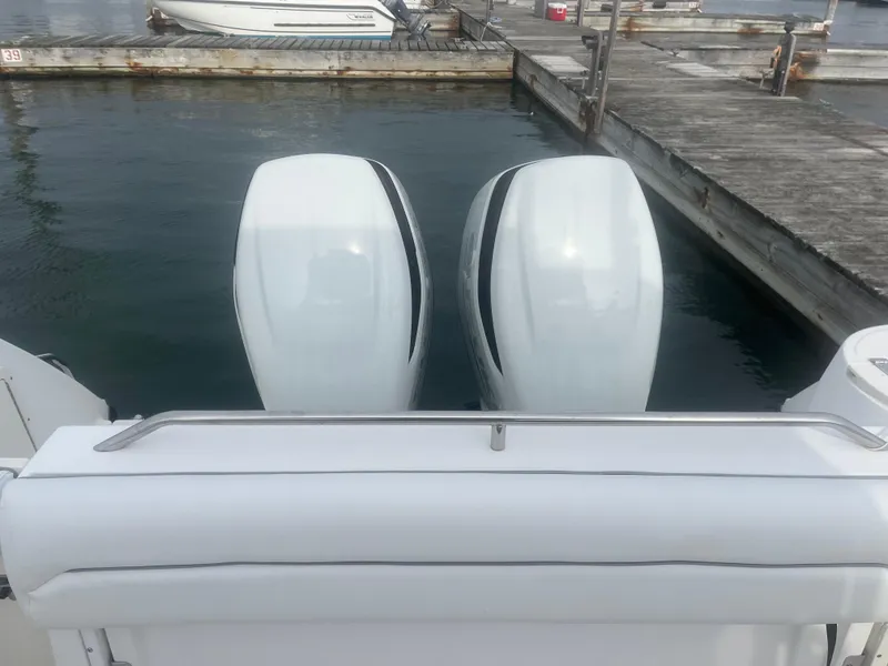 Slide: The Image of Twin outboard engines on a 2002 Boston Whaler 295 Conquest WA at dock. - 31