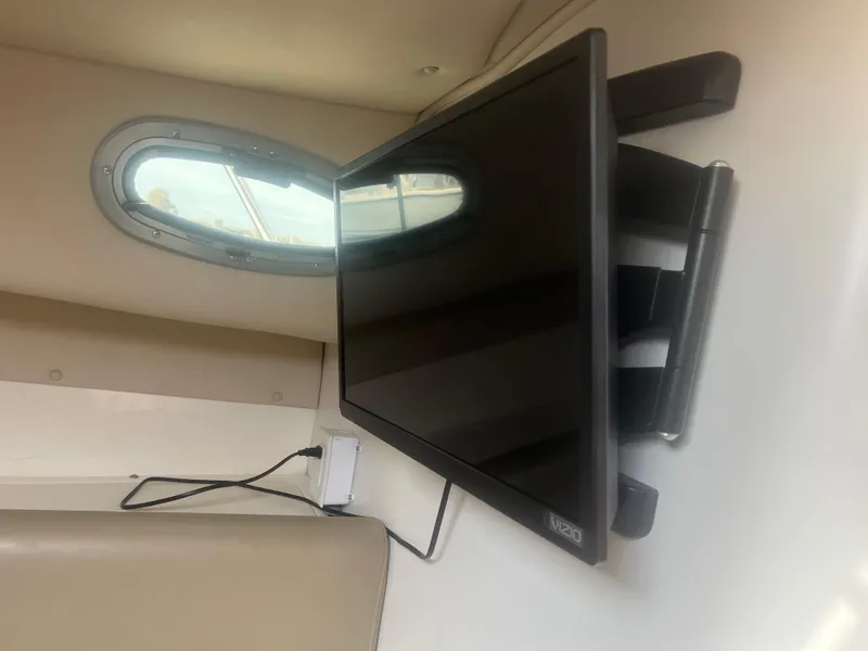 Slide: The Image of Flat screen TV mounted inside 2002 Boston Whaler 295 Conquest WA boat cabin. - 38