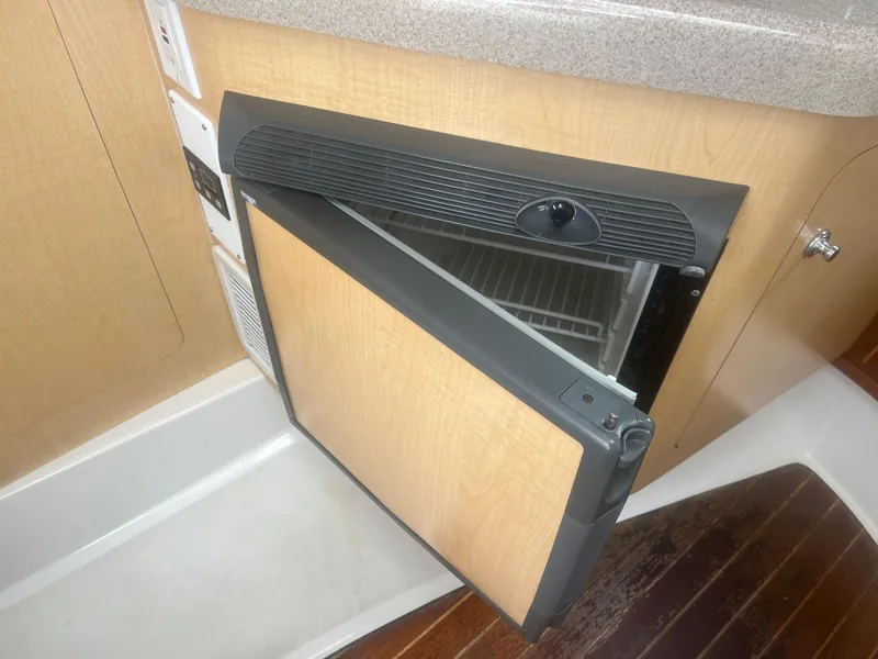 Slide: The Image of Open refrigerator in 2002 Boston Whaler 295 Conquest WA boat interior. - 39
