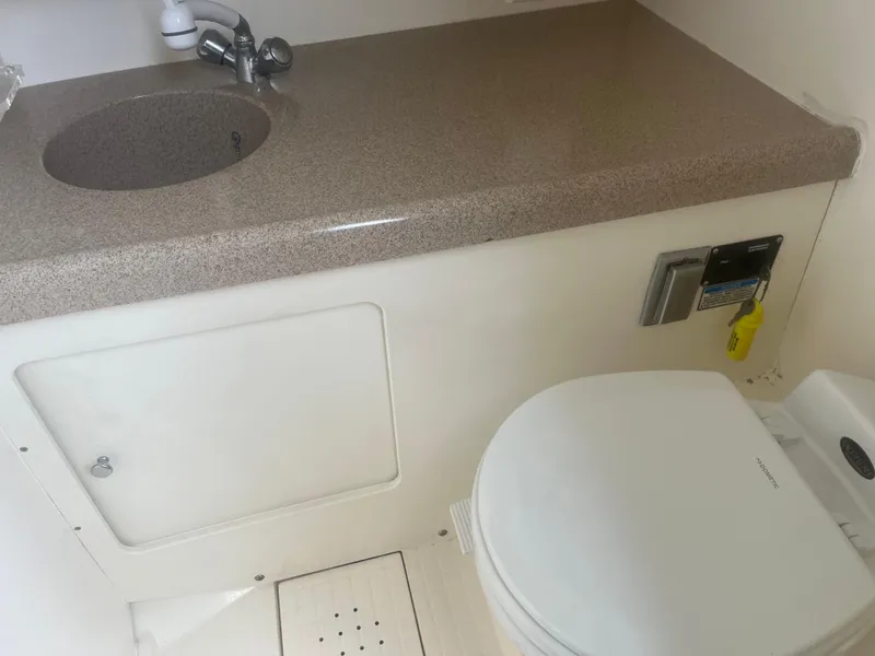 Slide: The Image of 2002 Boston Whaler 295 Conquest WA bathroom with sink and toilet. - 42