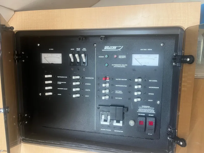 Slide: The Image of Electrical panel of a 2002 Boston Whaler 295 Conquest WA boat. - 44
