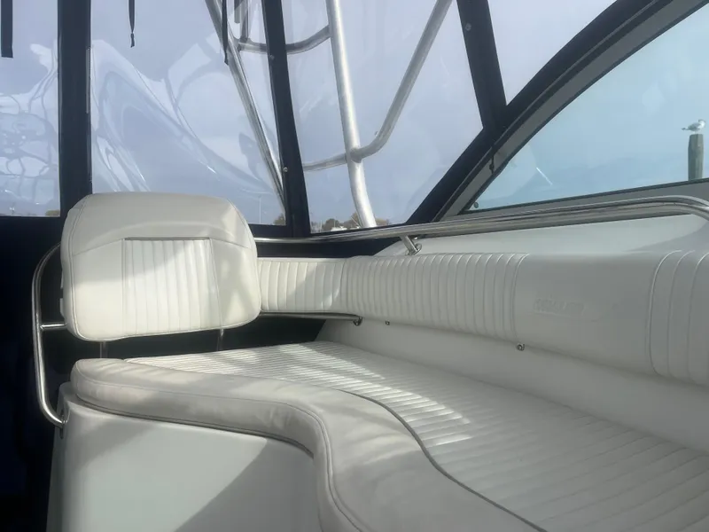 Slide: The Image of Interior of 2002 Boston Whaler 295 Conquest WA with white seating and sleek design. - 45