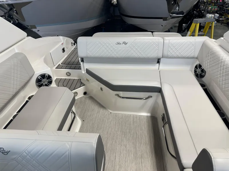 Slide: The Image of 2025 Sea Ray SDX 250 boat interior with white seating and modern design. - 17