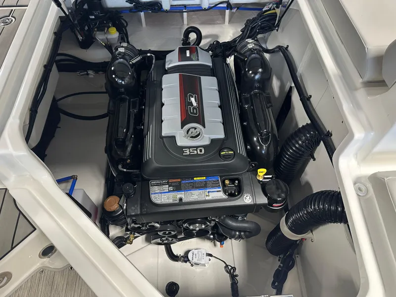 Slide: The Image of 2025 Sea Ray SDX 250 engine compartment showcasing powerful 350 horsepower engine. - 22
