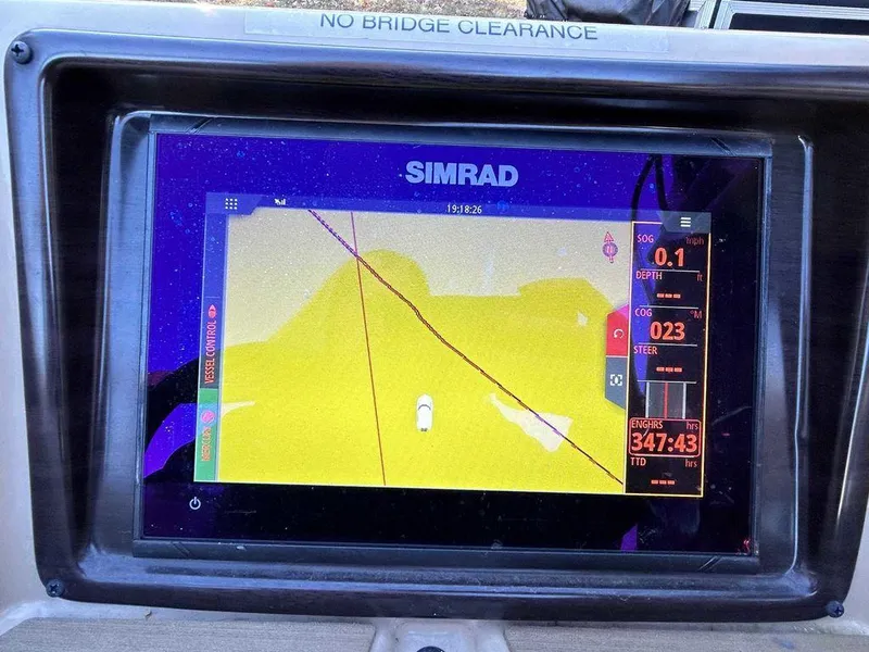 Slide: The Image of Simrad navigation display on 2021 Harris Cruiser 250 boat dashboard. - 10