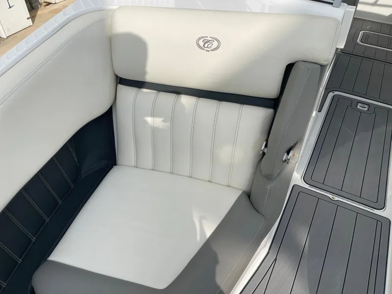 Slide: The Image of 2013 Cobalt 24SD boat interior with white and gray seating. - 20