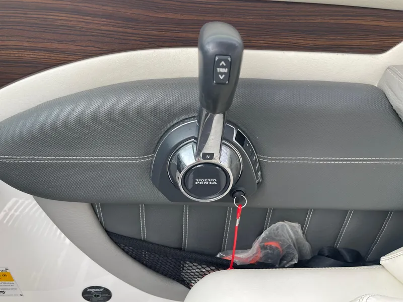 Slide: The Image of 2013 Cobalt 24SD boat throttle control with Volvo Penta branding. - 24