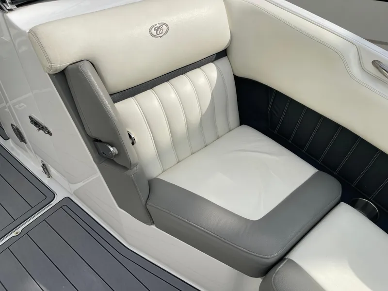 Slide: The Image of 2013 Cobalt 24SD boat seat with gray and white upholstery. - 26
