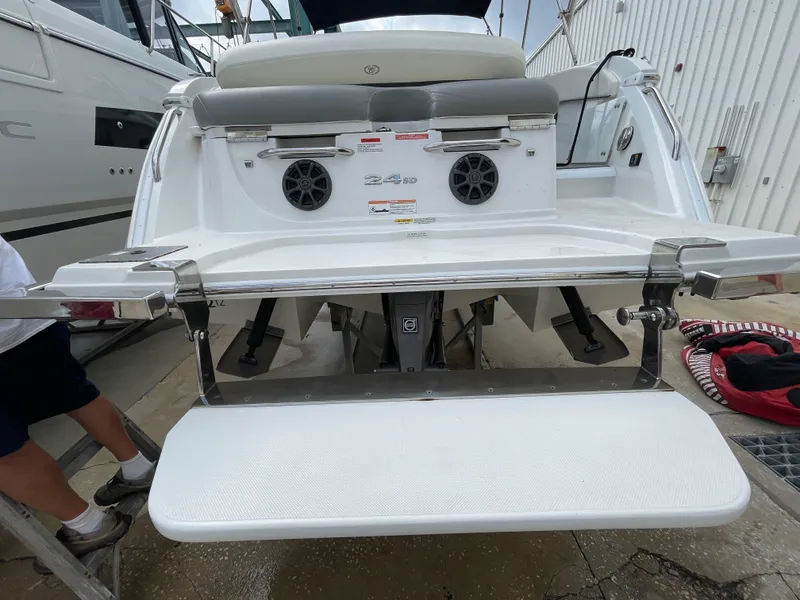 Slide: The Image of 2013 Cobalt 24SD boat stern with swim platform and speakers. - 38