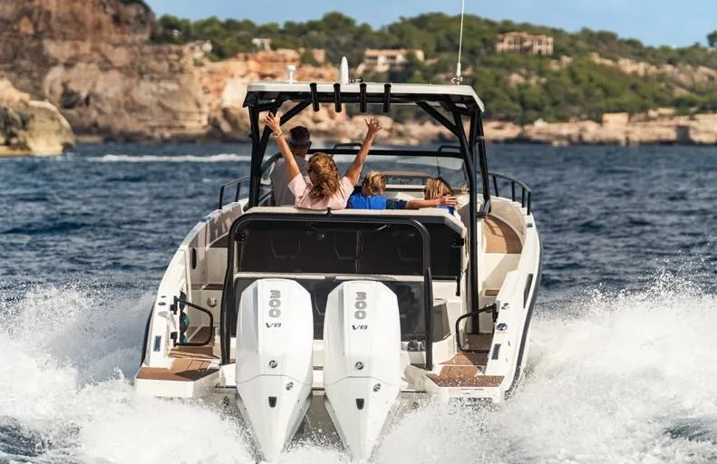 Slide: The Image of Navan S30 boat cruising with passengers, 2025 model, scenic coastal backdrop. - 3