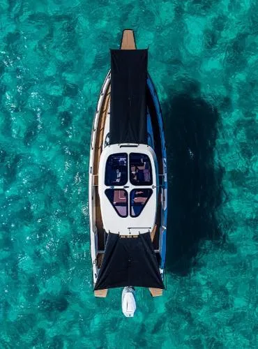 Slide: The Image of Aerial view of 2025 Navan S30 yacht on clear turquoise water. - 5