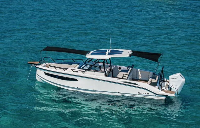 Slide: The Image of Navan S30 2025 boat cruising on clear blue water, featuring sleek design and modern amenities. - 6