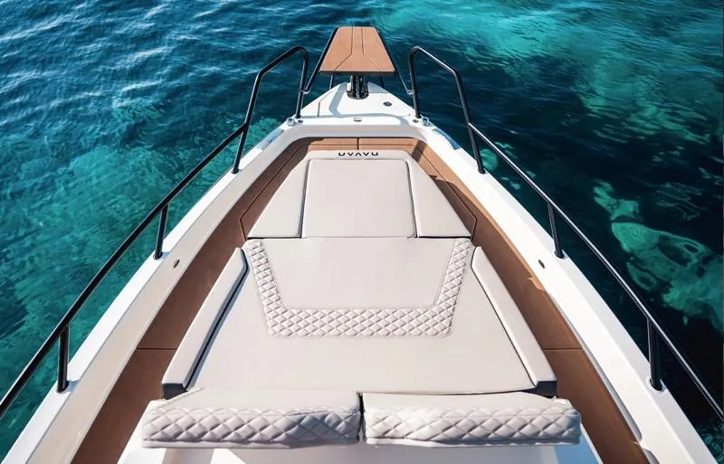 Slide: The Image of Navan S30 2025 boat deck with luxurious seating on clear blue water. - 7