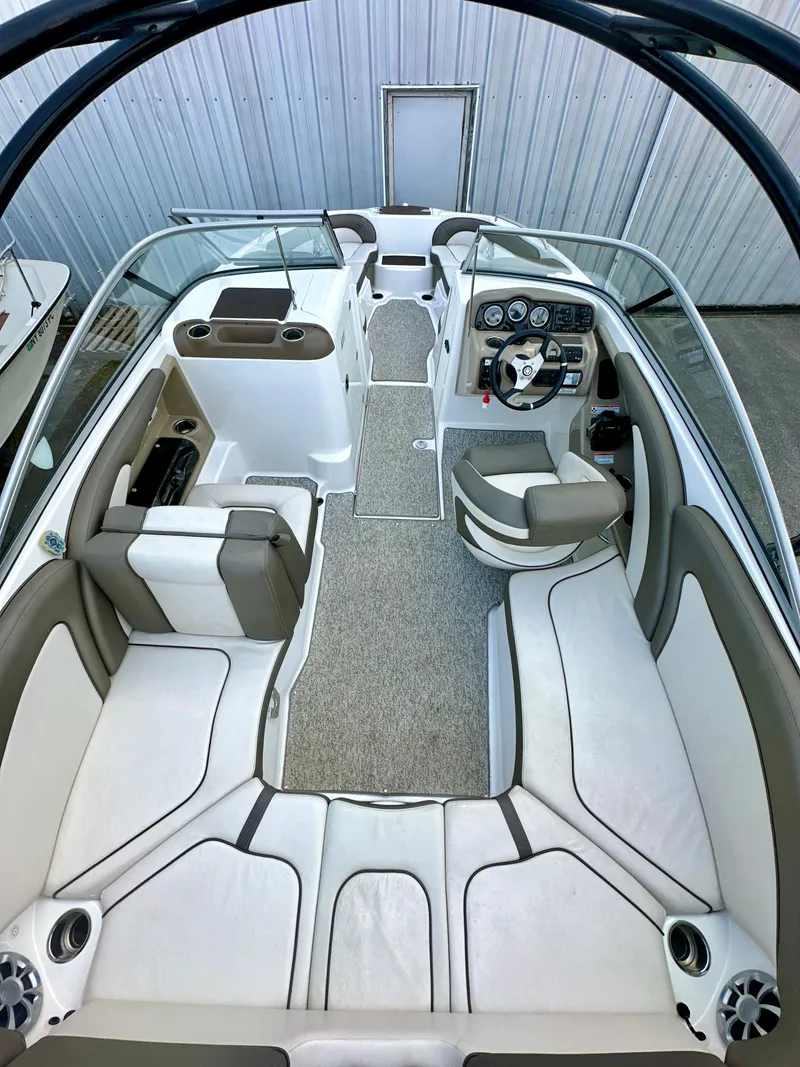 Slide: The Image of 2012 Yamaha Boats 242 Limited S interior with sleek seating and modern dashboard. - 6