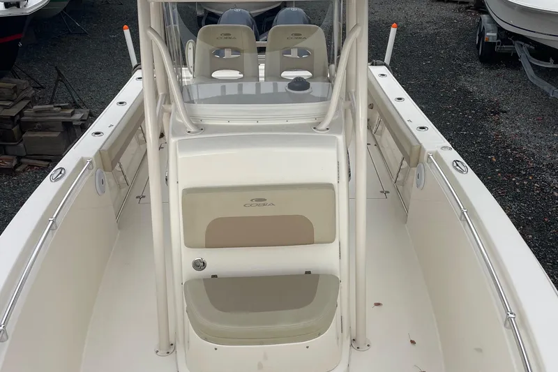 Slide: The Image of 2018 Cobia 261 boat interior with dual seats and console. - 13