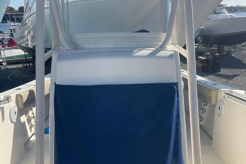 Slide: The Image of 2018 Cobia 261 boat interior with blue seating and white accents. - 22