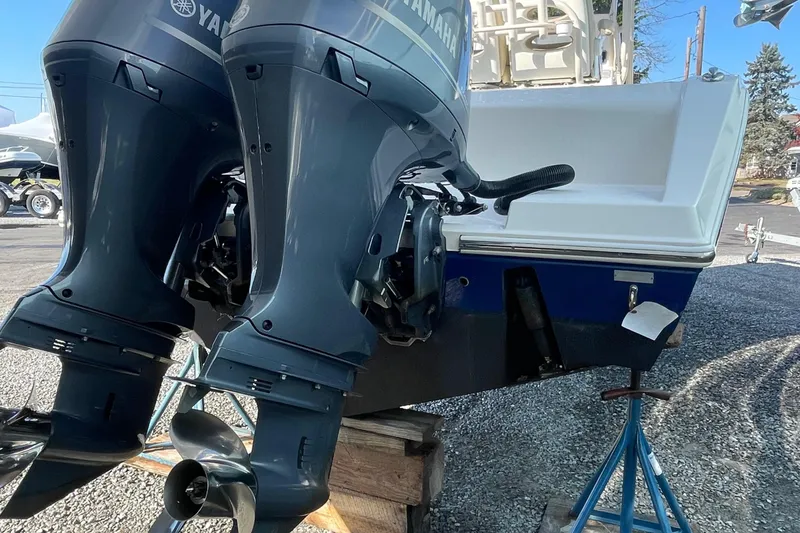 Slide: The Image of 2018 Cobia 261 boat with dual Yamaha outboard motors on display. - 3