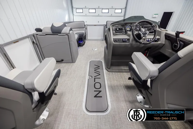 Slide: The Image of Interior of 2025 Avalon LSZ QLS boat with modern seating and dashboard. - 17